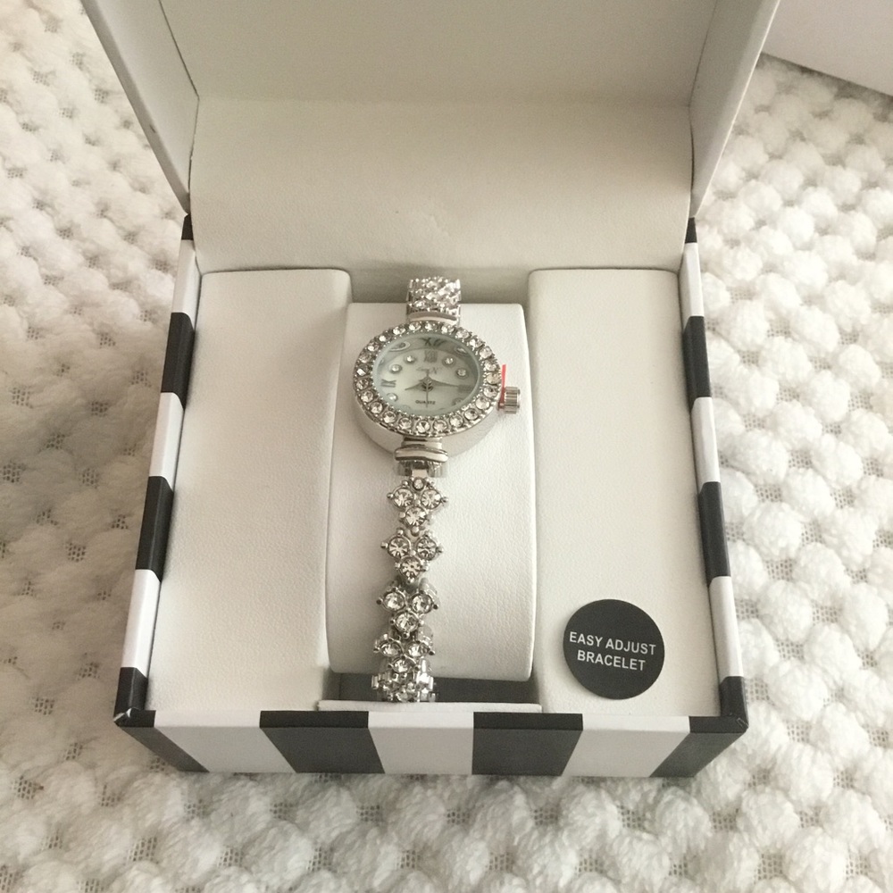 Quartz Movement Watch with Faux MOP Dial in SILVERTONE Adjustable Bracelet